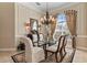 Formal dining room with a glass table and neutral decor at 2115 Calusa Lakes Blvd, Nokomis, FL 34275