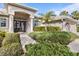 Inviting front entryway with double doors and landscaping at 2115 Calusa Lakes Blvd, Nokomis, FL 34275