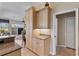 Kitchen features light wood cabinets, granite countertops and a view into the Gathering room at 2115 Calusa Lakes Blvd, Nokomis, FL 34275