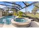 This luxurious pool and spa area is perfect for entertaining at 2115 Calusa Lakes Blvd, Nokomis, FL 34275