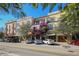 Row of colorful Mediterranean-style buildings with balconies and shops at 2200 Fruitville Rd, Sarasota, FL 34237