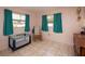 Charming bedroom with tiled floors and a crib at 2206 25Th W Ave, Bradenton, FL 34205