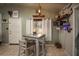 Small dining area adjacent to kitchen with farmhouse table at 2206 25Th W Ave, Bradenton, FL 34205