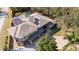 Aerial view of house with solar panels on the roof at 2232 Elcid Ct, Palm Harbor, FL 34683