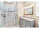 Elegant bathroom with a glass shower and granite vanity at 2232 Elcid Ct, Palm Harbor, FL 34683