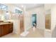 Bathroom with walk-in shower, double vanity, and a separate room at 2232 Elcid Ct, Palm Harbor, FL 34683