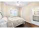 Comfortable bedroom with hardwood floors and a view at 2232 Elcid Ct, Palm Harbor, FL 34683