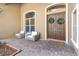 Welcoming entryway with double doors and comfortable seating at 2232 Elcid Ct, Palm Harbor, FL 34683