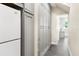 Long hallway with built in storage and gray cabinets at 2232 Elcid Ct, Palm Harbor, FL 34683