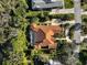 Bird's-eye view of a home with a red tile roof and swimming pool at 230 Osprey Point Dr, Osprey, FL 34229