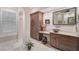 Bathroom with a vanity, large mirror and custom cabinetry at 230 Osprey Point Dr, Osprey, FL 34229