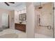 Spa-like bathroom with walk-in shower, modern fixtures and neutral tile at 230 Osprey Point Dr, Osprey, FL 34229