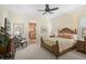 Bright bedroom with ensuite bathroom and a cozy sitting area at 230 Osprey Point Dr, Osprey, FL 34229