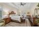 Main bedroom with hardwood floors, a king-size bed and access to a private patio at 230 Osprey Point Dr, Osprey, FL 34229