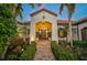 Elegant home exterior with lush landscaping and a welcoming entryway at 230 Osprey Point Dr, Osprey, FL 34229