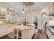 Spacious kitchen featuring granite island, custom cabinetry, and breakfast bar at 230 Osprey Point Dr, Osprey, FL 34229