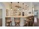 Breakfast bar with stylish pendant lights and custom cabinetry at 230 Osprey Point Dr, Osprey, FL 34229