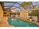 Relaxing pool area with covered patio and spa at 230 Osprey Point Dr, Osprey, FL 34229