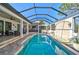 Inviting pool and spa area with covered patio at 230 Osprey Point Dr, Osprey, FL 34229