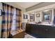 Bathroom with double vanity, tiled floor, and large window at 230 Salisbury St, Port Charlotte, FL 33954