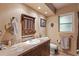 Single vanity bathroom with tile flooring and window at 230 Salisbury St, Port Charlotte, FL 33954