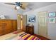 Bedroom with double bed, ceiling fan, and wood dresser at 230 Salisbury St, Port Charlotte, FL 33954