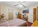 Bedroom with double bed, ceiling fan, and ample closet space at 230 Salisbury St, Port Charlotte, FL 33954