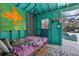 Colorful pool house with daybed and whimsical decor at 230 Salisbury St, Port Charlotte, FL 33954