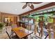 Screened porch with dining table, ceiling fan, and view of backyard at 230 Salisbury St, Port Charlotte, FL 33954