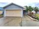 House exterior with a beige garage door and gray walls at 2309 30Th W Ave, Bradenton, FL 34205