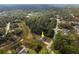 Aerial view showing a house nestled among trees at 2415 Nowatney Ave, North Port, FL 34286