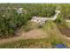 Aerial view of the house and surrounding land at 2415 Nowatney Ave, North Port, FL 34286