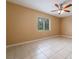 Bright bedroom with ceiling fan and large window at 2415 Nowatney Ave, North Port, FL 34286