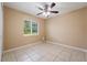 Well lit bedroom with ceiling fan and window at 2415 Nowatney Ave, North Port, FL 34286