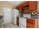 Kitchen with white appliances and wood cabinets at 2415 Nowatney Ave, North Port, FL 34286