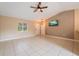 Bright living room with tile floors and access to other rooms at 2415 Nowatney Ave, North Port, FL 34286