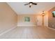 Living room with tile floors, high ceilings and neutral walls at 2415 Nowatney Ave, North Port, FL 34286