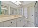 Bathroom with white vanity, toilet and shower at 26071 Paysandu Dr, Punta Gorda, FL 33983