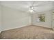 Spacious bedroom with neutral walls and carpet, plus ceiling fan at 26071 Paysandu Dr, Punta Gorda, FL 33983