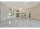 Bright living room featuring marble floors and high ceilings at 26071 Paysandu Dr, Punta Gorda, FL 33983