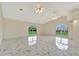 Large living room with marble floors and high ceilings at 26071 Paysandu Dr, Punta Gorda, FL 33983