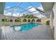 Sparkling pool with a screened enclosure and patio at 26071 Paysandu Dr, Punta Gorda, FL 33983