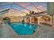 Inviting, screened pool area with a spacious patio at 26071 Paysandu Dr, Punta Gorda, FL 33983