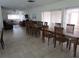 Large dining room with a long wooden table and chairs at 2657 Woodgate Ln # E4, Sarasota, FL 34231