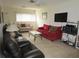 Comfortable living room featuring two sofas and a coffee table at 2657 Woodgate Ln # E4, Sarasota, FL 34231