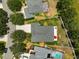 Aerial view showcasing the home's layout, well-manicured backyard, and outdoor living area at 2925 122Nd E Pl, Parrish, FL 34219