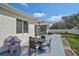 Inviting backyard patio with an outdoor dining set, creating a perfect space for al fresco meals at 2925 122Nd E Pl, Parrish, FL 34219