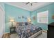 Charming bedroom features a bed with floral bedding and a bedside table with lamps at 2925 122Nd E Pl, Parrish, FL 34219