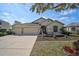 Charming single-story home featuring a three-car garage and nicely manicured landscaping at 2925 122Nd E Pl, Parrish, FL 34219