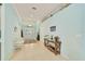 Bright foyer with tile flooring, complemented by a decorative table and stylish decor at 2925 122Nd E Pl, Parrish, FL 34219